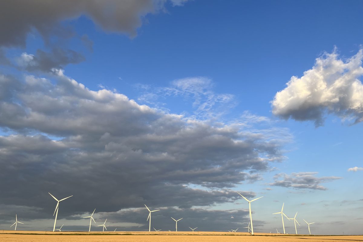 Operational wind farm in a Romanian wheat field